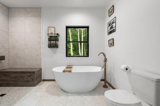 Primary spa like suite with free-standing tub
