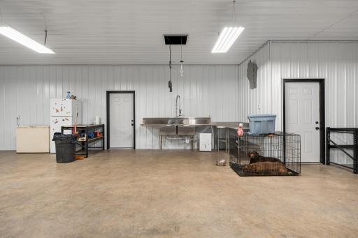 Game processing corner with winch and stainless steel prep counters, double bay sink