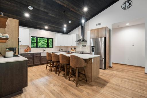 Beautiful tile backsplash, stainless steel appliances, and high end finishes