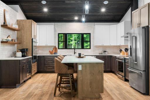 Beautiful island, coffee bar, wine cooler, wall ovens with plenty of space to host