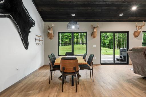 A private northern Wisconsin retreat with mature pines and hardwoods, your dining room view