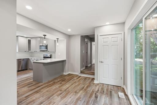 Looking back to the main floor half bath and the primary bedroom.jpg