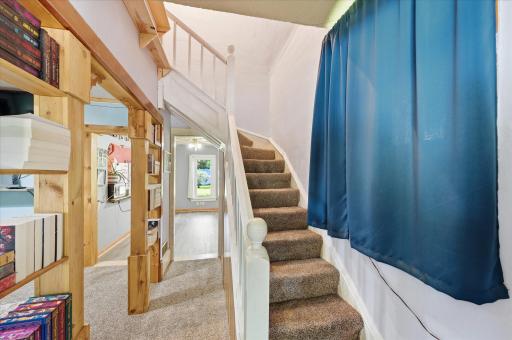 Open hallway and stairs to the upper level.