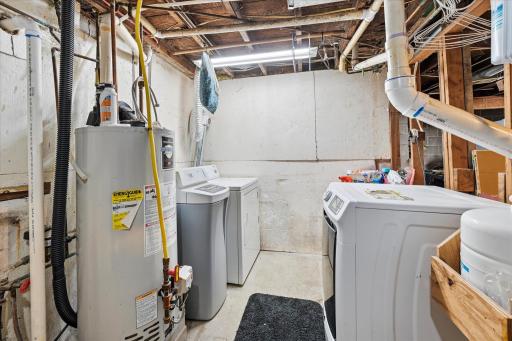 Laundry area in the lower level. Some new pvc plumbing.