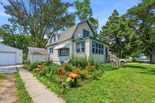 Welcome home! Many perennials line the sidewalk up to the entry. Maintenance-free steel lap siding on the house.