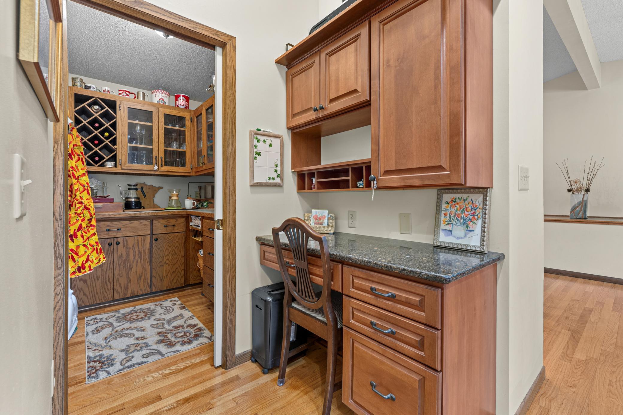 kitchen work station that leads into a butlers pantry