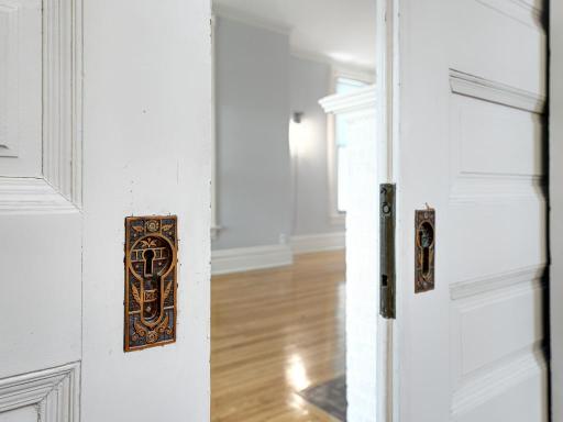 Classic pocket doors lead to the living room