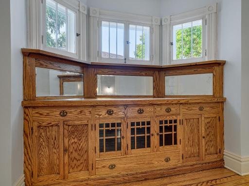 A classic built in buffet and original swing out windows lend character to the dining space