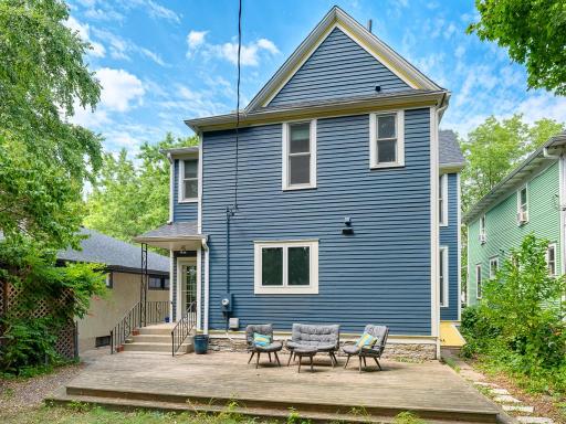 There is a large 28 x 14 deck and a yellow steel cellar door on the east side of the home to the basement