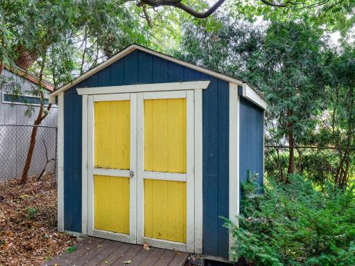 A storage shed in the back yard holds all your gardening needs