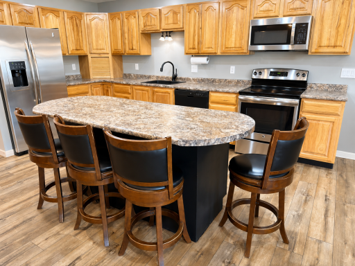 Kitchen with stainless appliances and Amish made hickory cabinets