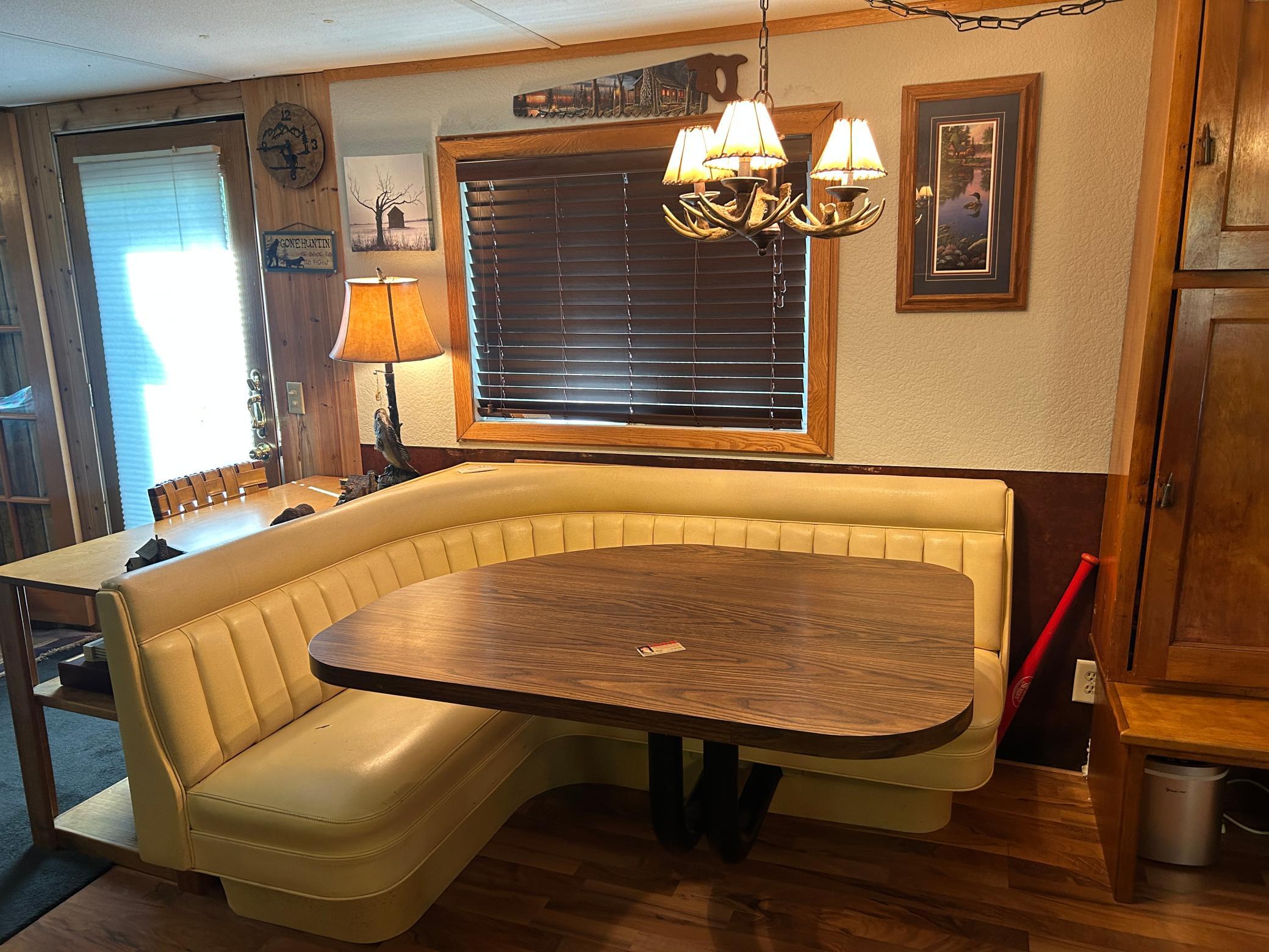 A shot of the dining room table and booth.