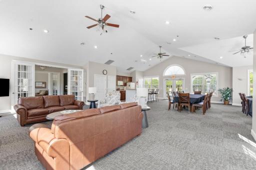Another look at the freshly painted sweeping clubhouse layout, showing off the dramatic ceiling heights and airy, welcoming atmosphere!