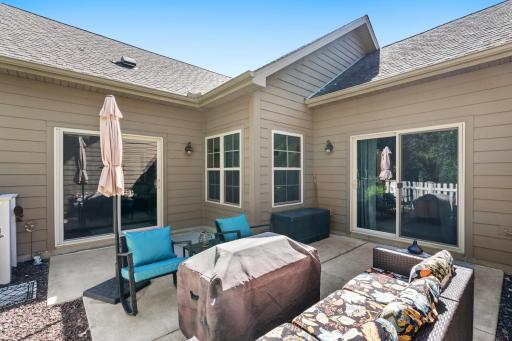 Another wonderful view of the private patio, showcasing both patio doors. This location also includes a natural gas line that can be used for your favorite outdoor gas grill or cozy fire pit!
