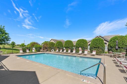 Beat the summer heat! Pristine, crystal-clear heated outdoor community pool surrounded by ample lounge seating, serene nature views and beautiful open skies!
