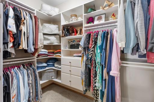 Close-up view of the brand-new custom Ashley Furniture modular walk-in closet system, featuring premium built-in dresser drawers, dual-hanging rods, and exceptional storage shelving!