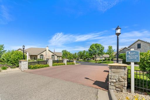 Welcome to The Villas at Rivers Edge! Beautiful main entry stone monuments welcoming you into this quiet & highly desired community, via the Industrial Blvd entrance!
