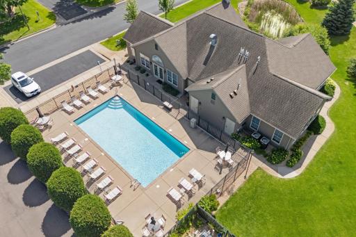 Spectacular aerial view of the sparkling heated outdoor community pool nestled perfectly alongside the main clubhouse complex!