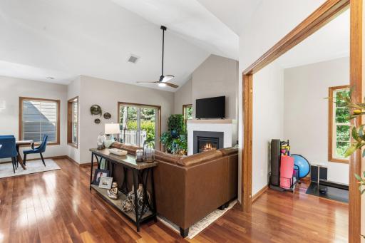 Exceptional open-concept layout illustrating the seamless, airy flow from the dining space through the main vaulted living areas and into the versatile home office alcove!