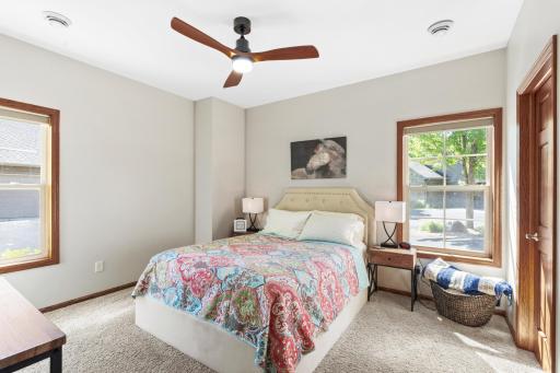Generously sized second bedroom featuring plush carpeting, crisp contemporary paint, upgraded modern ceiling registers, and an all-new quiet-motor ceiling fan!