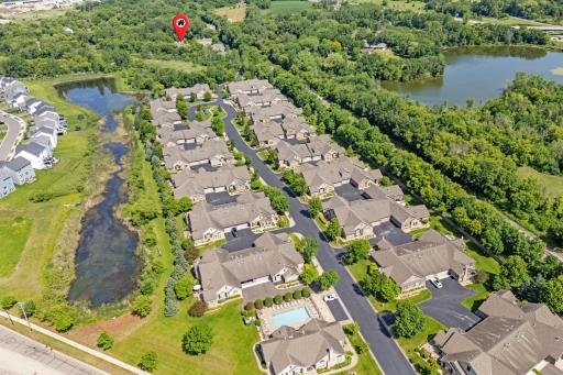 Breathtaking aerial view illustrating the premier, secluded cul-de-sac enclave layout of this upscale Villas at Rivers Edge community! Drive through it and feel the luxury! Notice the private pinned location of this amazing townhome!