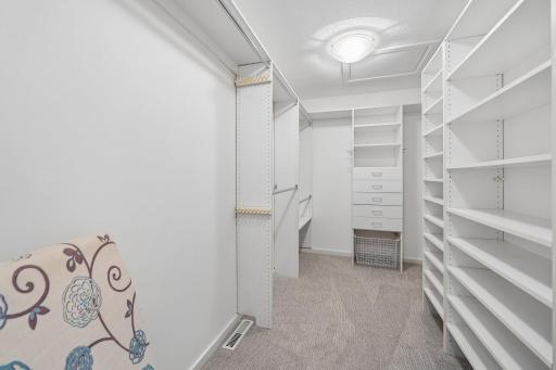Primary bedroom walk in closet