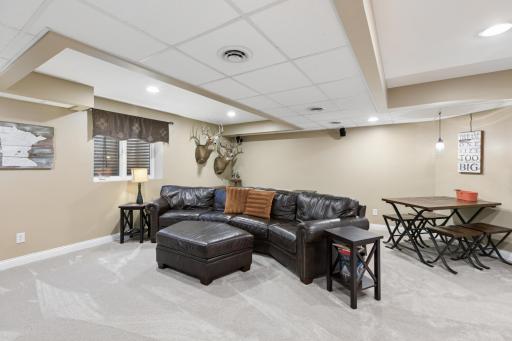 View of the lower level family room. This spacious room measures 18x18 and is great space to enjoy a movie or to play games with all of the extra space.