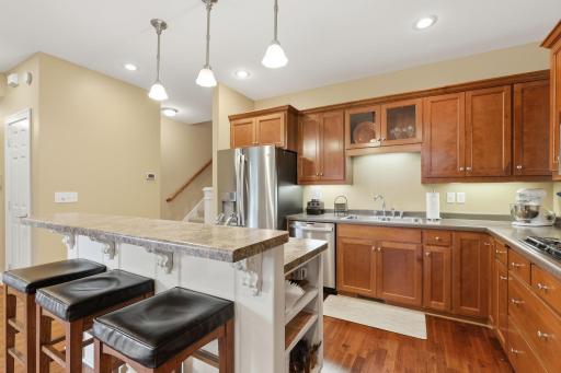 With dual wall ovens that can be controlled by your phone along with a gas cooktop this kitchen will be a joy to prepare meals for family or friends and has plenty of prep space and storage.