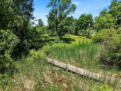 Bridge over wetland on East end of property to current seller's backyard