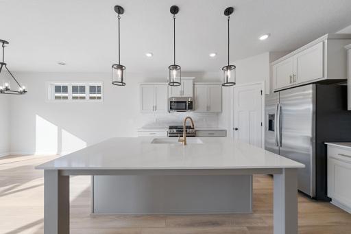 Representational Purpose Only. Huge Kitchen Island, brushed gold faucet and