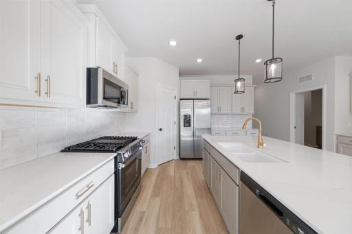 Representational Purpose Only. Large Kitchen, gas slide in range!