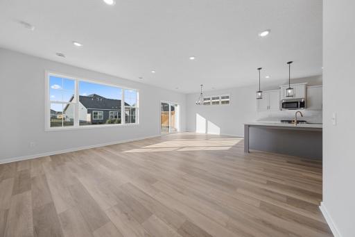 Representational Purpose Only. Open Concept Living Dining Kitchen- let the sun shine in! Note the piano windows gracing the dining area for that extra design pop!