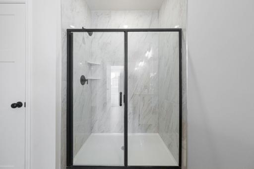 Representational Purpose Only. Tiled shower- matt black Pivot door!