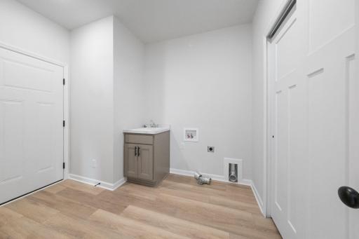 Representational Purpose Only. Mud Room features laundry sink and cabinet- Washer/Dryer hook ups too!