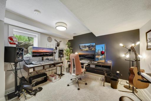 Lower level bedroom, and fifth bedroom overall. Currently used as a music studio!