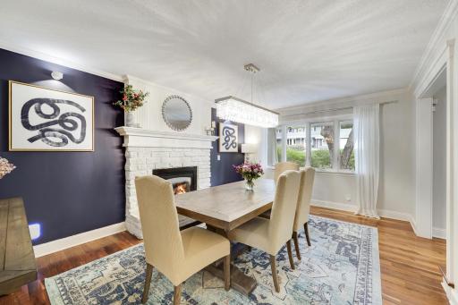 Formal dining room with stone gas burning fireplace.