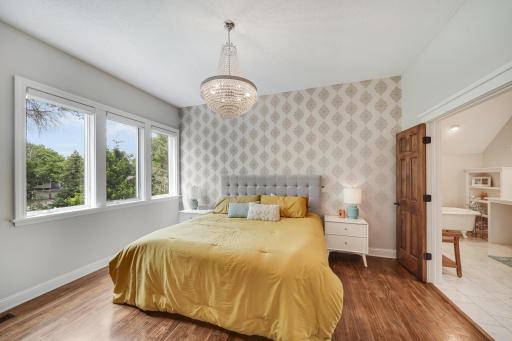 Upstairs primary bedroom with spacious closets, large bathroom suite and walk-in closet