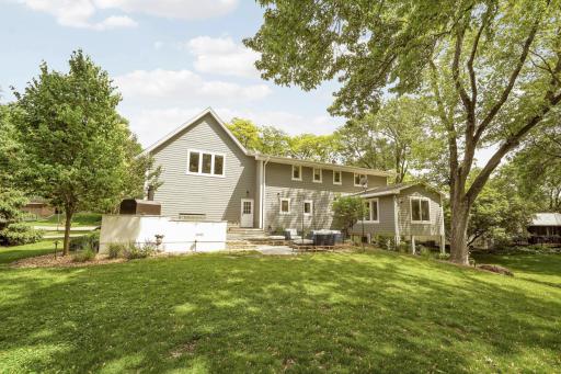Back of the house with outdoor patio, grill and pizza oven!