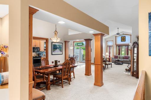 The open-concept main level seamlessly connects the dining area, kitchen, informal dining space, and living room, creating an ideal layout for everyday living and entertaining.