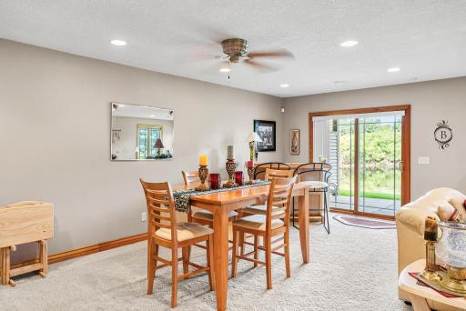 Sliding glass doors provide walkout access to the patio and backyard, extending the living space outdoors.