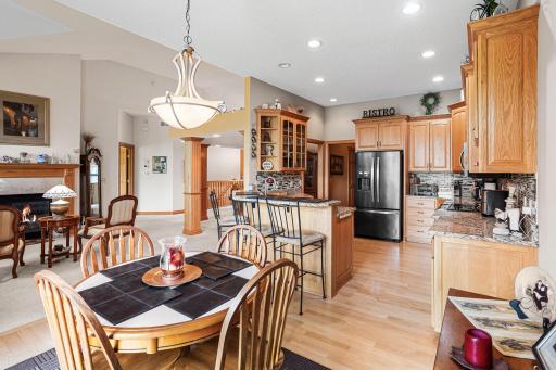 The open kitchen flows seamlessly into the informal dining area and living room, making it easy to stay connected while cooking or entertaining.