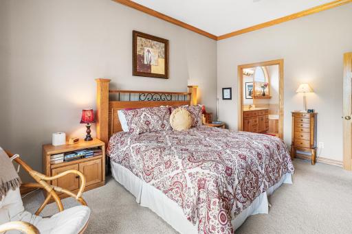 The private primary suite offers direct access to the en suite bath and walk-in closet for everyday convenience.