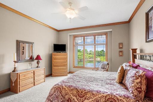 Enjoy waking up to tranquil pond views from the primary bedroom, complete with abundant natural light and a spacious layout.