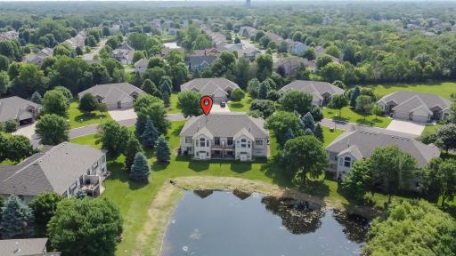This home's location overlooking the pond, offering a private setting with expansive lawn space between neighboring homes.