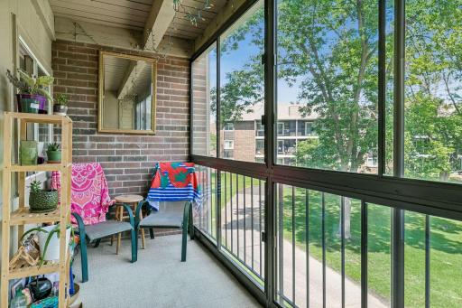 Larger porch overlooking the pool and picnic area