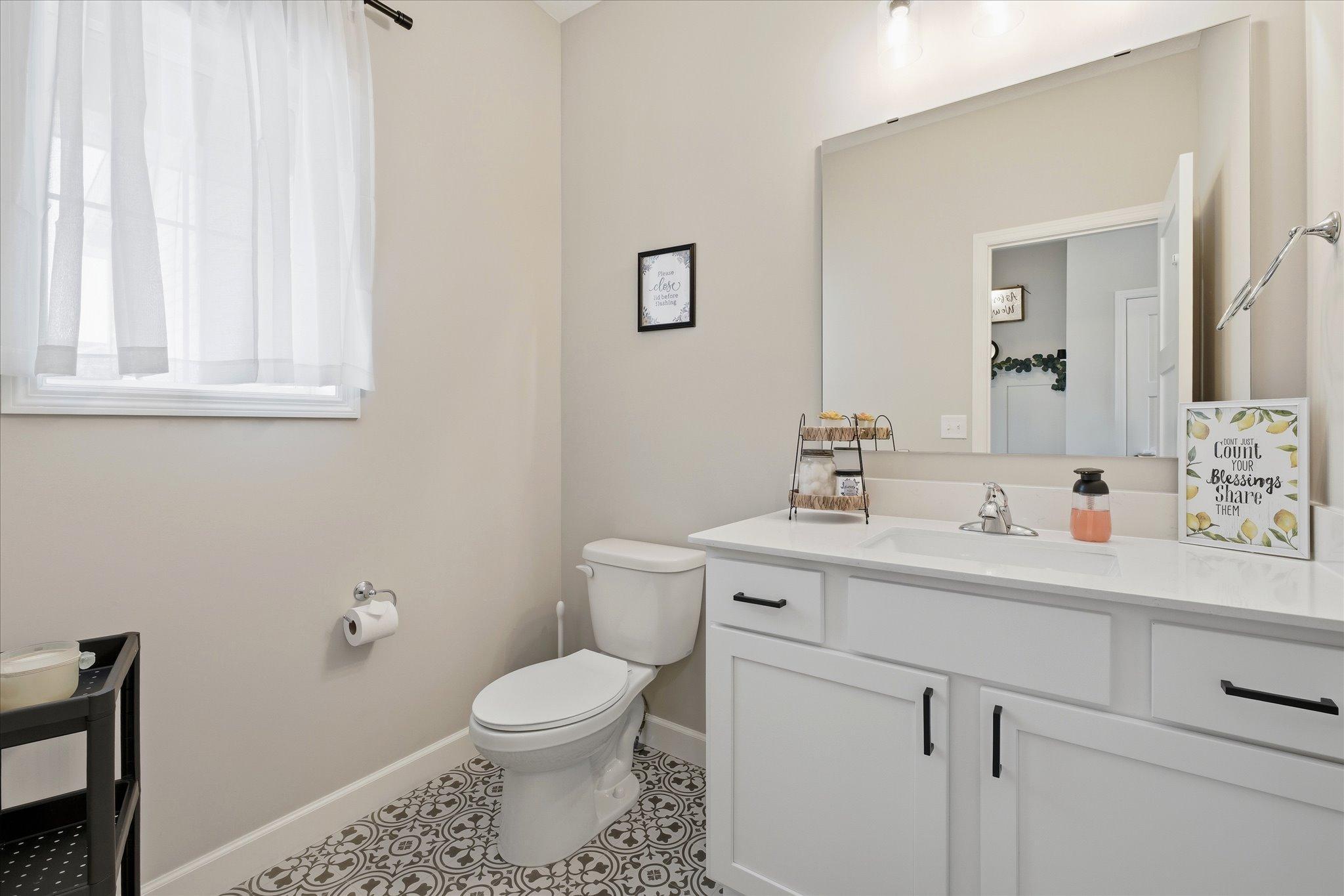 Main Level bright and fresh 1/2 bathroom