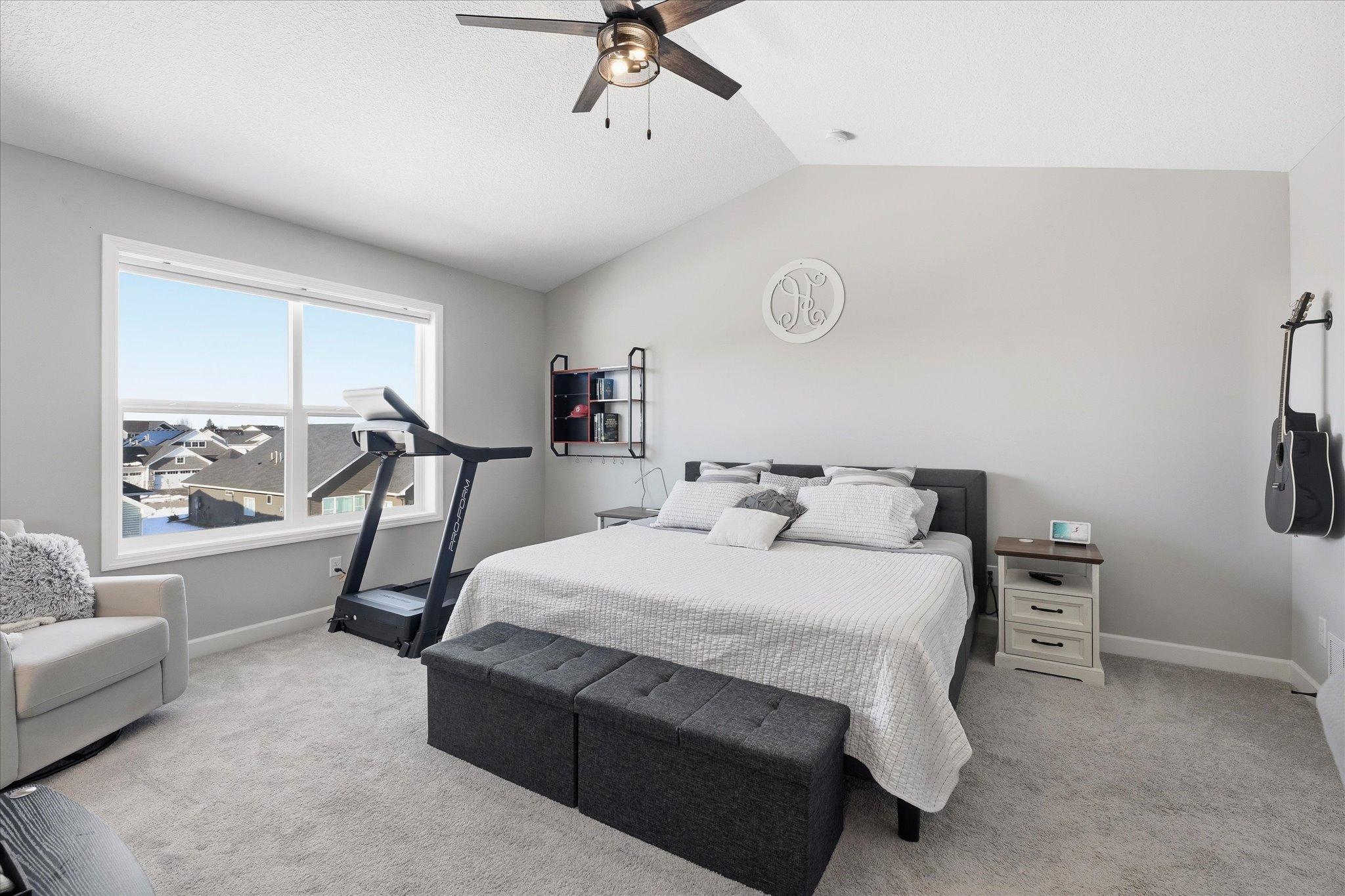 Vaulted primary suite stuns with walk-in closet with builtins and a spa-like bathroom