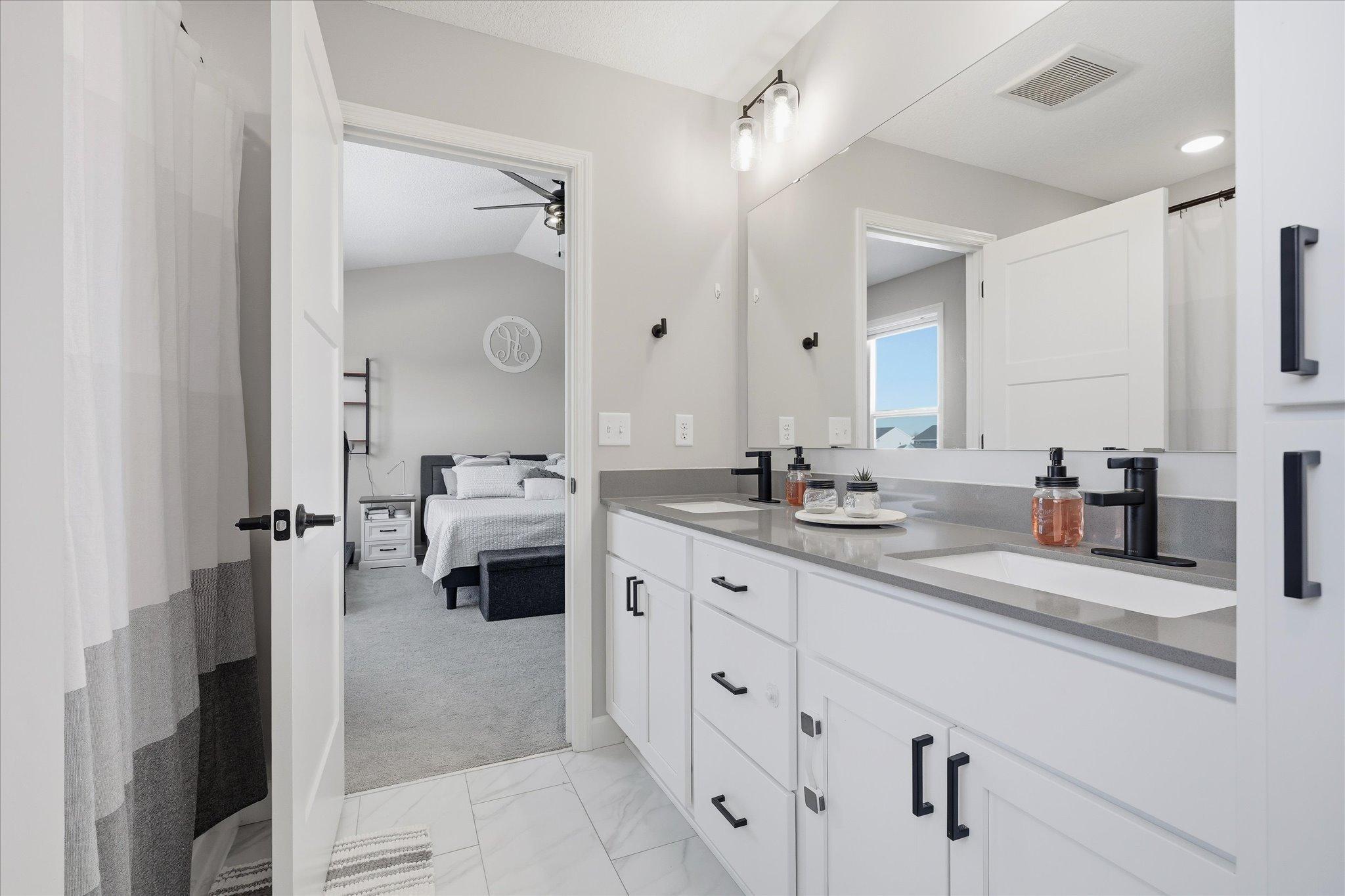 Primary ensuite with spa-like soaking tub and separate shower
