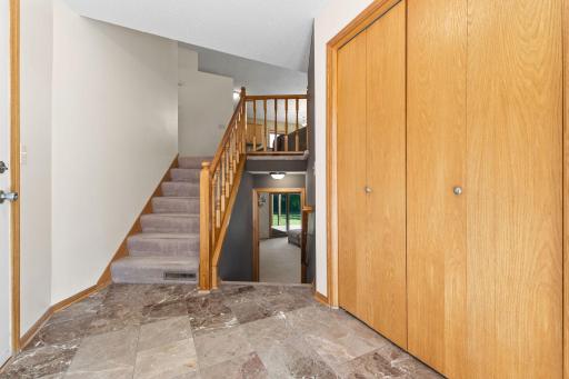 A large coat closet can be found to your right, and access to the attached 2 car garage to your left.