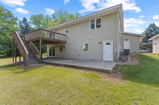 This patio runs the entire length of the home., with a convenient service door that enters the unfinished laundry/utility room.